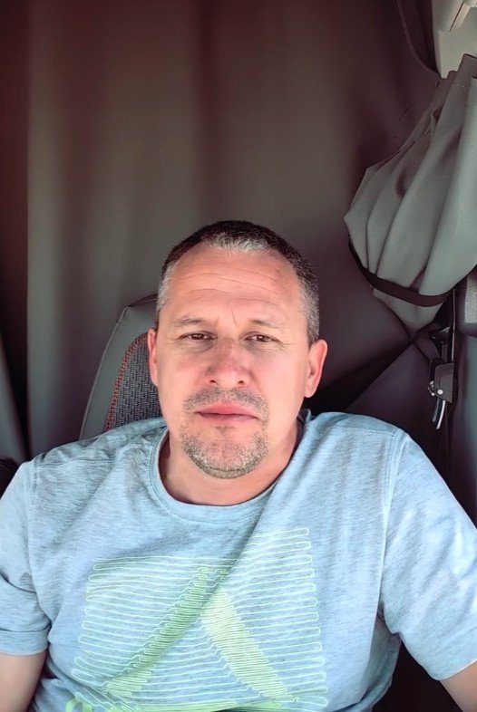 Vitalii Markov in the cab of a semi truck